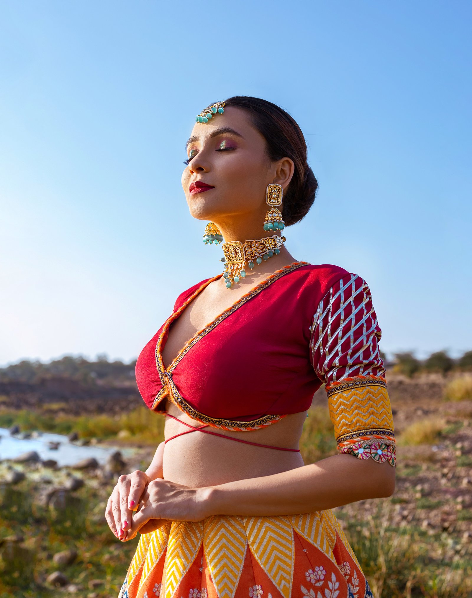 Hitakshi Chatterjee in a red and mustard festive lehenga with kundan jewellery