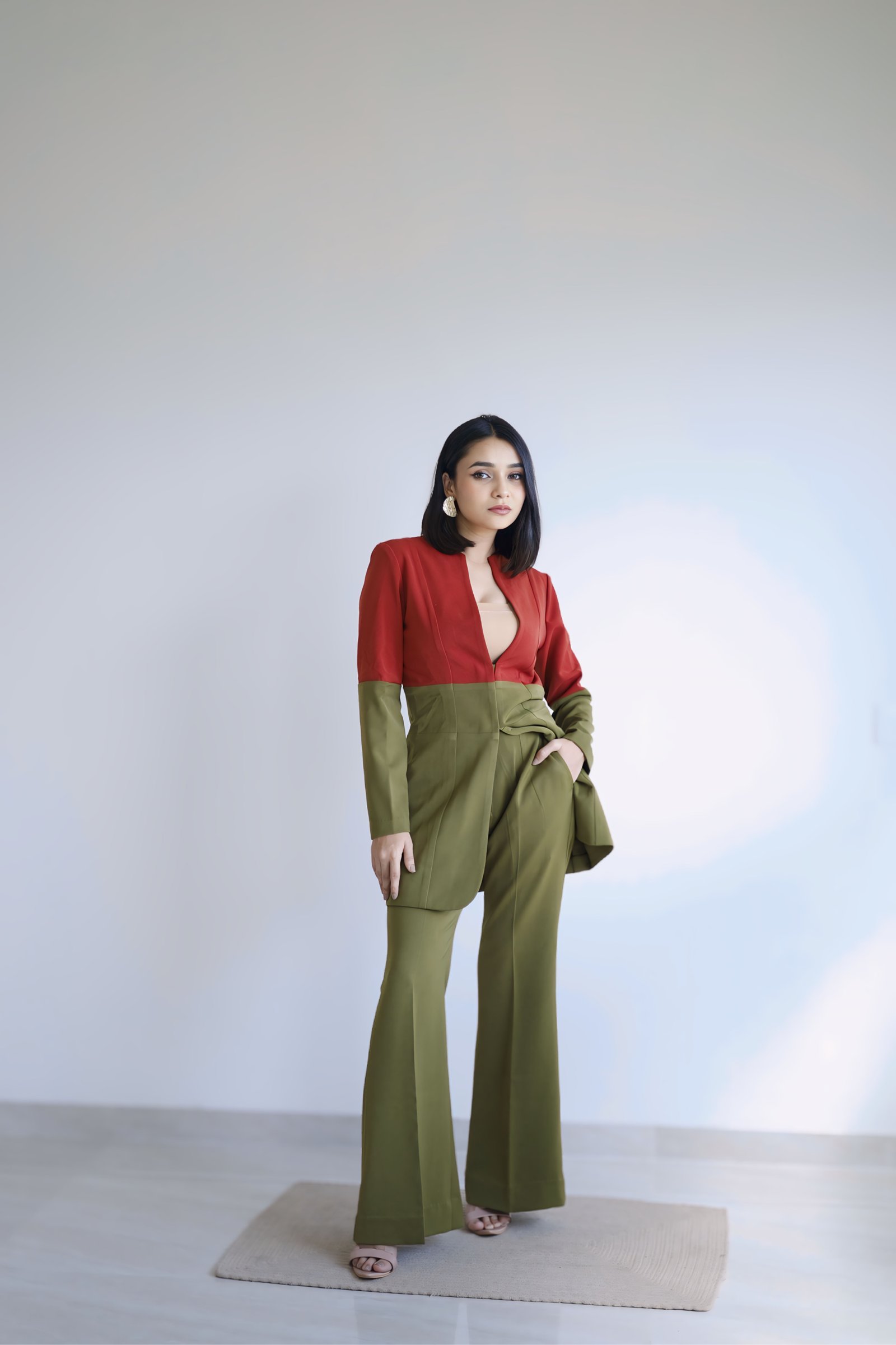 Hitakshi Chatterjee in a red and olive colour-block co-ord set, studio fashion shoot